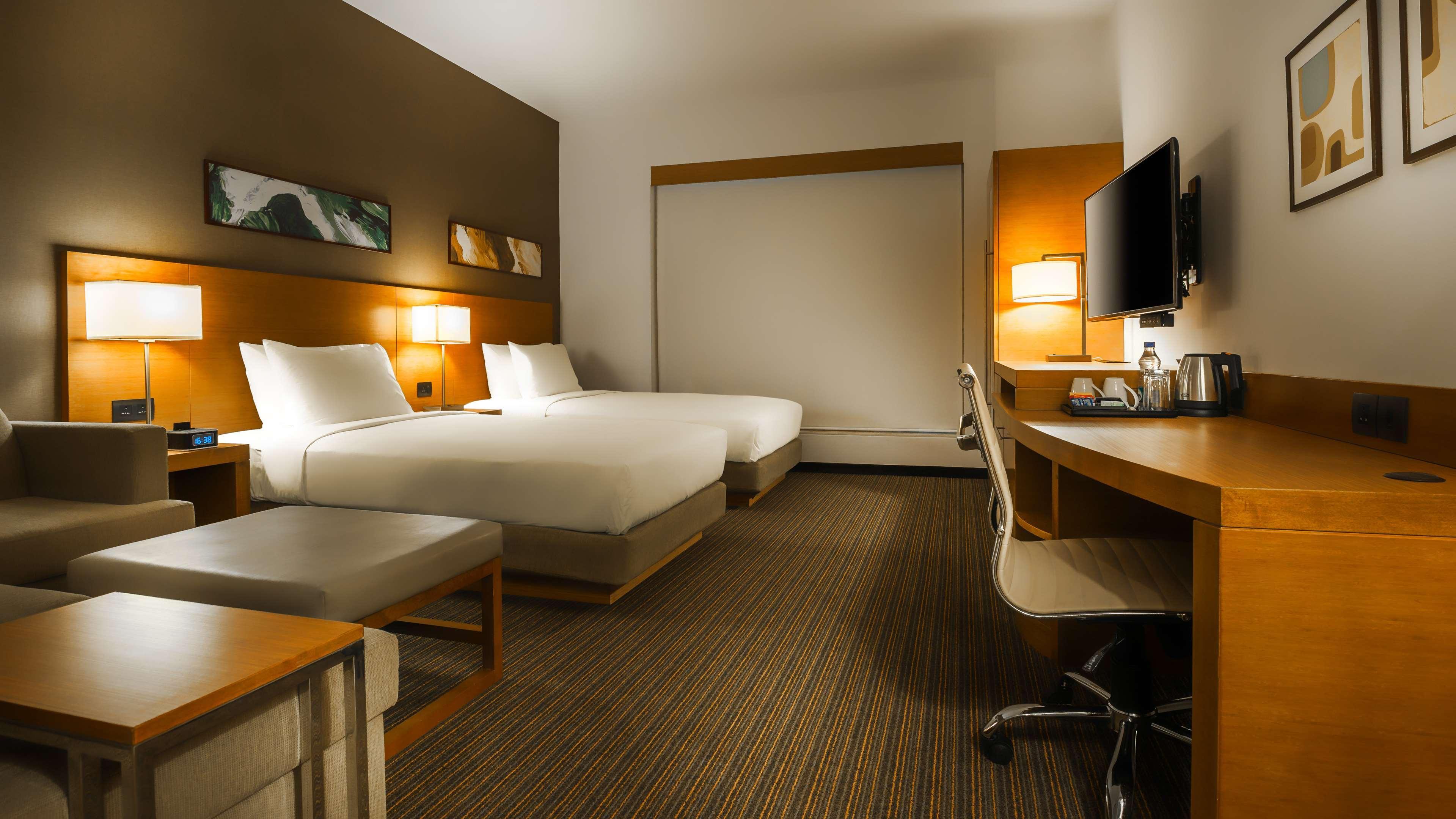 Hyatt Place Gurgaon Udyog Vihar Exterior foto A typical room at the Holiday Inn Express